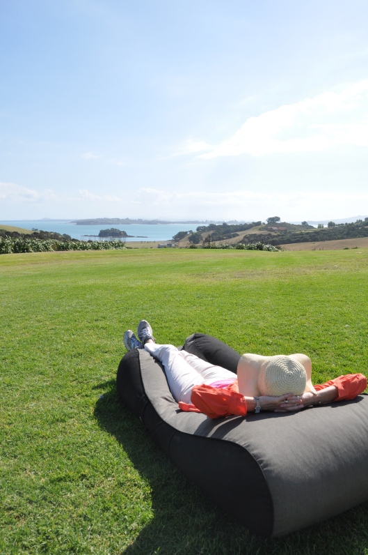 Relaxing on bean bags on Cable Bay lawn